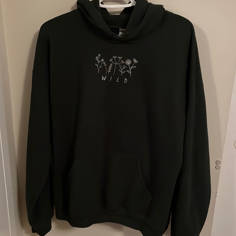 Embroidered Hoodie with wildflowers and “WILD” embroidered.